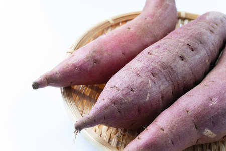 Sweet potatoes on a white backgroundの写真素材