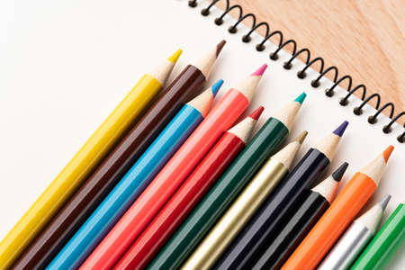 Colored pencils and sketchbooksの写真素材