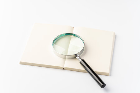Book with magnifying glassの写真素材