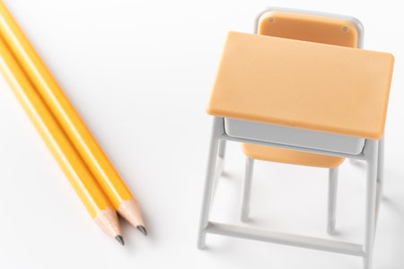 <p>School desk and chair miniatures and pencils Image of school work</p>の写真素材