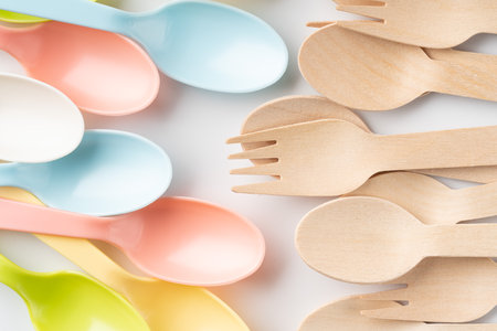 Plastic and wooden spoons and forksの写真素材