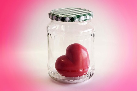 Heart waiting for love - Red heart in the glass bottleの写真素材