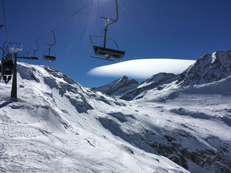 Ski lift, sunny day in the mountainsの写真素材
