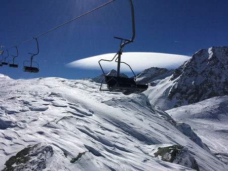 Ski lift, sunny day in the mountainsの写真素材