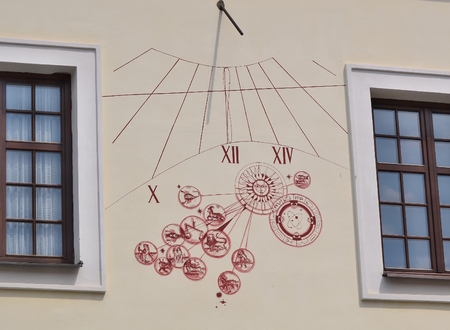 sundial on the wall of the house, South Bohemia, Czech Republic