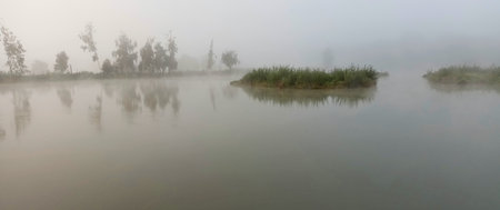 misty morning over the Vrbo ponds near Cesky Budejovice, South Bohemia, Czech Republicの写真素材