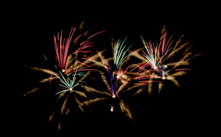 Abstract background of fireworks in the form of a spiral on a black backgroundの写真素材