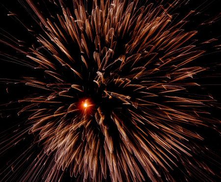 Abstract background of fireworks in the form of a spiral on a black backgroundの写真素材
