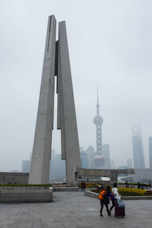 Unidentified people visit the Shanghai Bund People's Heroes Monument