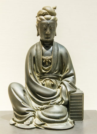 Statue of a seated buddha in the Museum of Chinaの写真素材