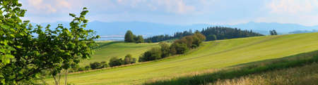 Liptov panorama with Low Tatras (Nizke Tatry) and Liptovkska Mara water lake reservoir in the background. Summertime in the Northern Slovakia, Slovak Republic, Europe.の写真素材