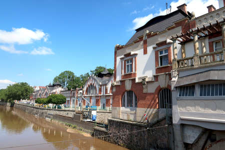 Historic building of hydroelectric power station called Hucak in Hradec Kralove, Czech Republic in the middle of summerの写真素材