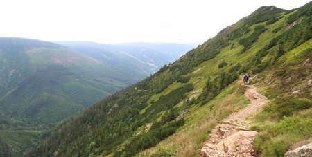 Hiking in Kronose (Giant Mountains) in the Czech Republic with blurred tourists in the distanceの写真素材