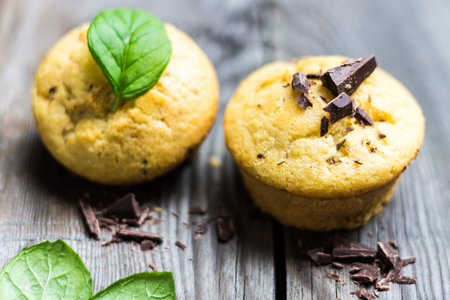Chocolate Muffins on Wooden Backgroundの写真素材