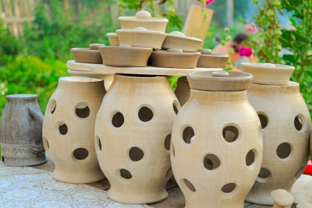 several ceramic pots on the table outdoorの写真素材