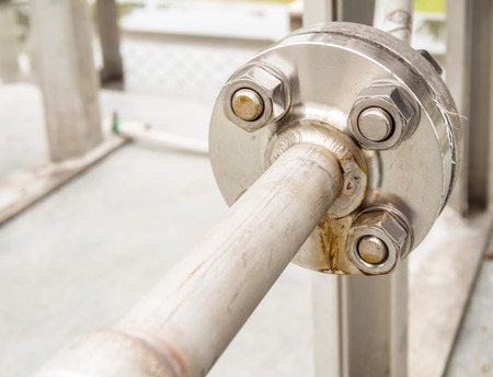 Stainless flange with bolts and nuts in gas supply systemの写真素材