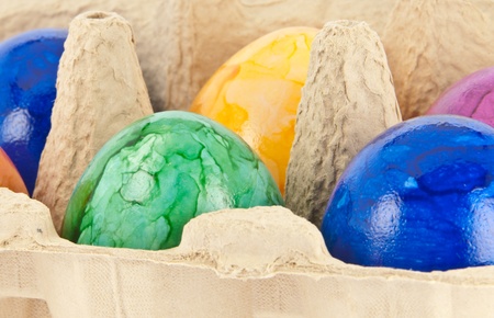 Colorful easter eggs in a brown box
