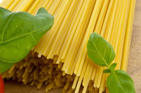Spaghetti with basil and tomatoの写真素材