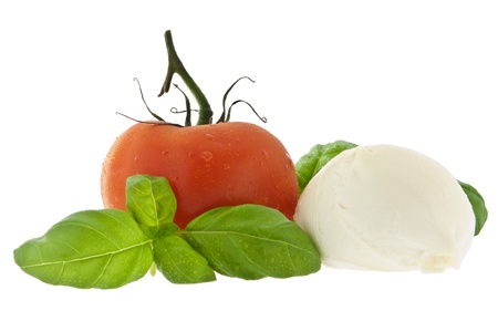 Mozzarella cheese, tomato and fresh basil isolated on white 