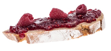 Bread with Raspberry Jam and fresh fruits isolated on white