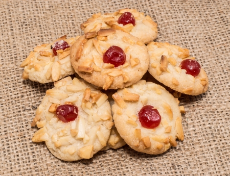 Cookies with Sweets on top on rustic backgroundの写真素材