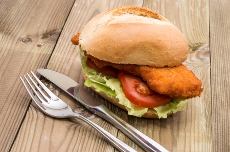 Sandwich with fried meat on wooden backgroundの写真素材
