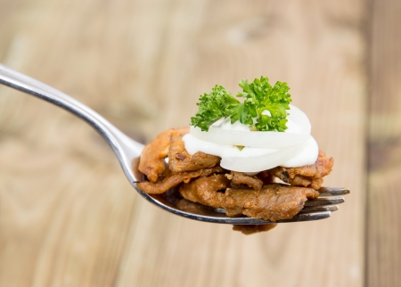 Kebab on a fork  wooden background の写真素材