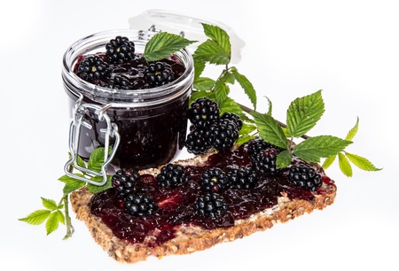 Bread and Glass with Blackberry Jam isolated on white