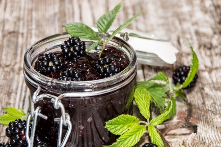 Blackberry Jam in a glass on wooden backgroundの写真素材