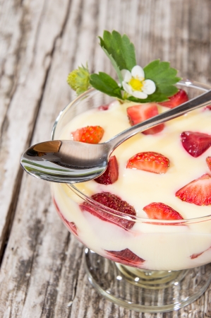 Vanilla Pudding with Strawberries on wooden backgroundの写真素材