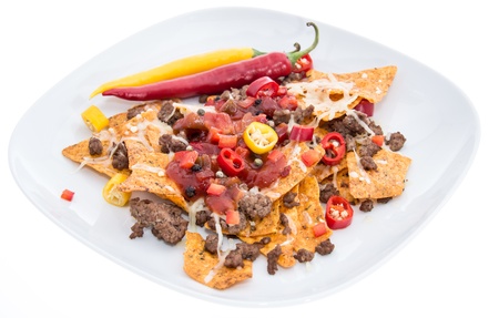 Nachos with Meat and Cheese isolated on white backgroundの写真素材