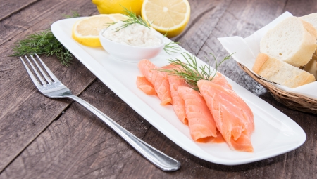 Plate with Salmon on wooden backgroundの写真素材