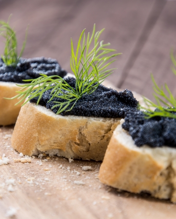 Baguette with Caviar on wooden backgroundの写真素材