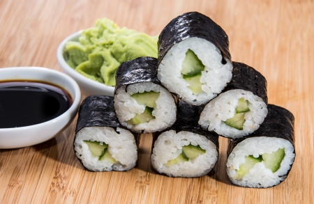 Heap of Maki Rolls on wooden backgroundの写真素材
