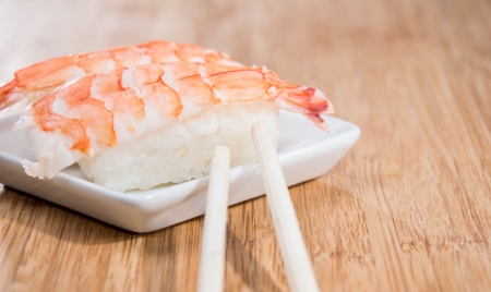 Nigiri with prawns on a small plateの写真素材