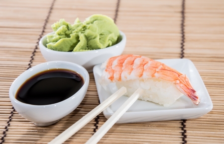 Nigiri Sushi with Soy Sauce and Wasabi on a small plateの写真素材