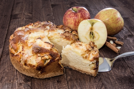 Cutted Apple Pie on wooden backgroundの写真素材