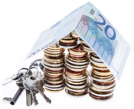 House consisting of Coins isolated on white backgroundの写真素材