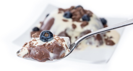 Portion of Chocolate Pudding with sauce isolated on whiteの写真素材