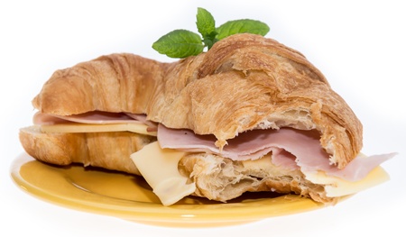 Croissant with Ham and Cheese isolated on whiteの写真素材