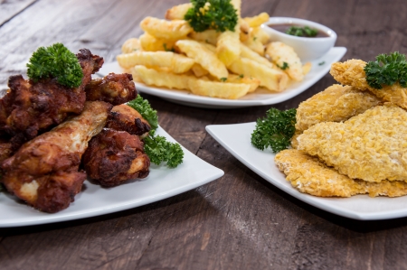 Fingerfood on a plate (wooden background)の写真素材