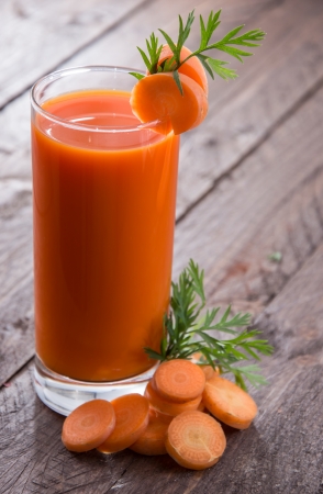 Carrot Juice with fresh carrotsの写真素材