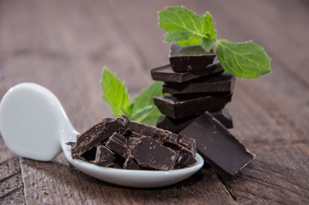 Stacked Chocolate with Mint on wooden backgroundの写真素材