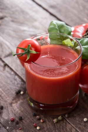 Fresh made Tomato Juice on wooden backgroundの写真素材