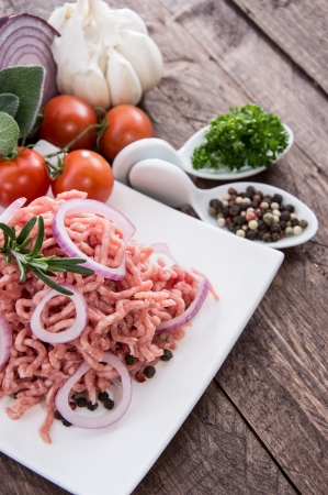 Minced Meat on wooden backgroundの写真素材