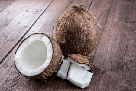 Cracked Coconut on wooden backgroundの写真素材