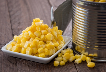 Canned Corn on wooden backgroundの写真素材