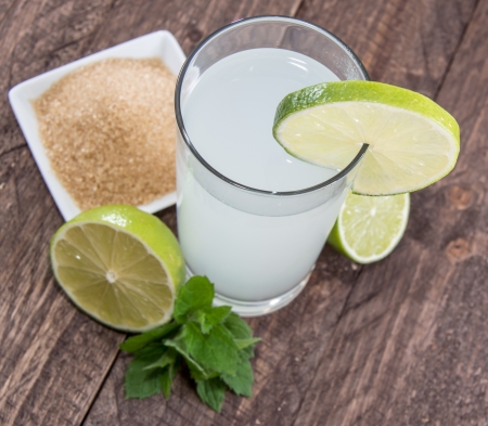 Fresh Lime Juice on wooden backgroundの写真素材