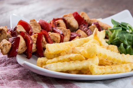 Fresh Skewer with french fries on wooden backgroundの写真素材