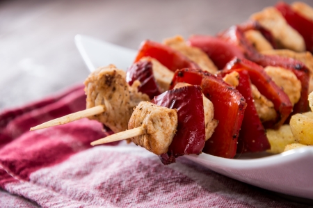 Fresh grilled Skewer with french fries on wooden backgroundの写真素材